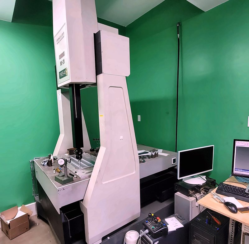 The Cordax RS-25 coordinate measuring machine in the inspection room, a part set up on the granite table