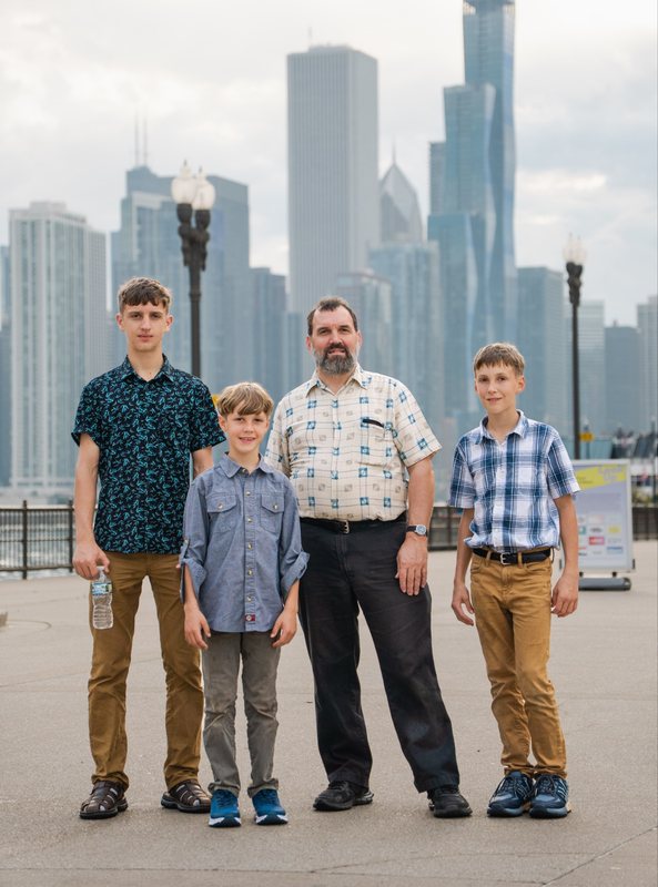 Steve Fisher and his three sons in front of the Chicago skyline, in town for the IMTS machine tool show